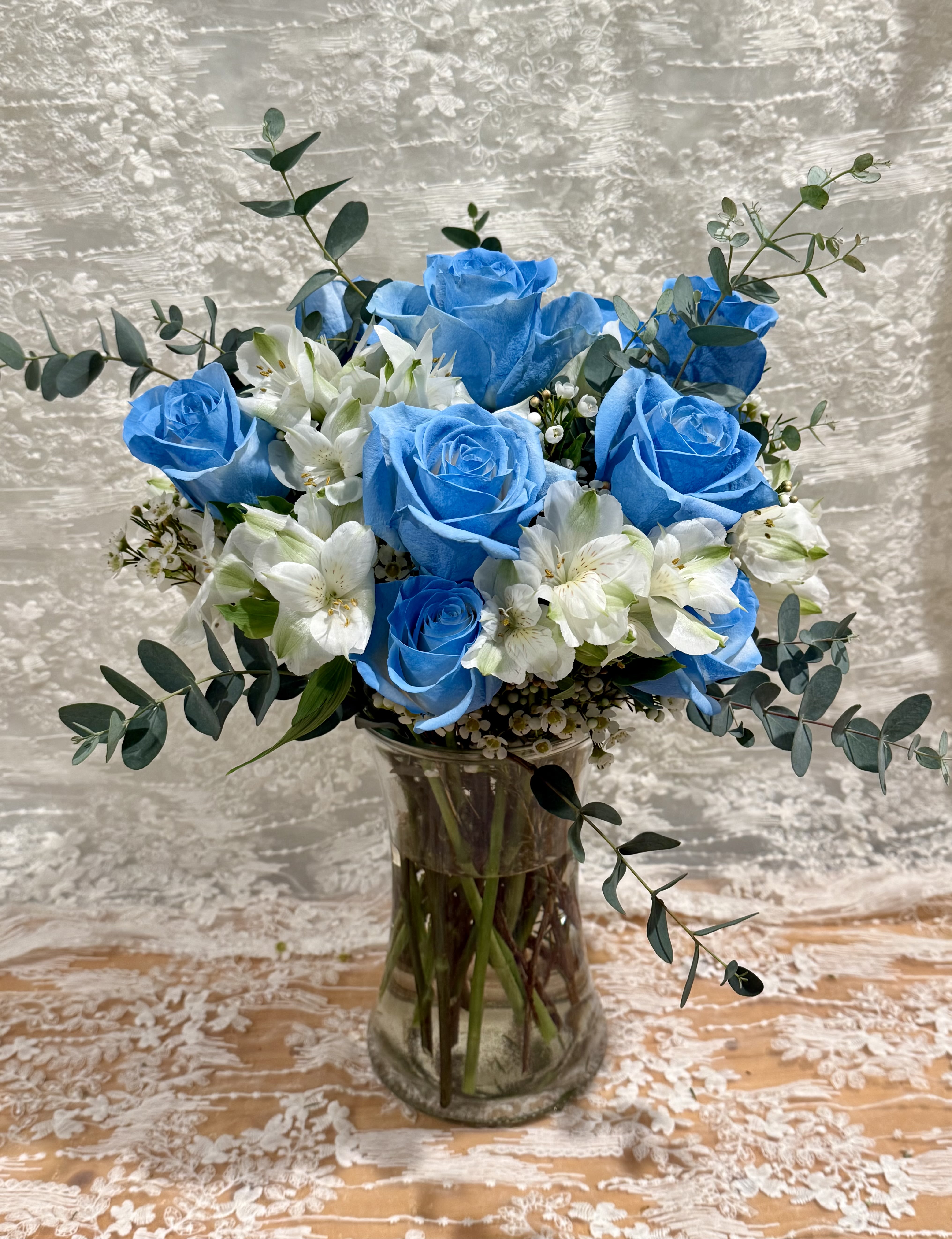 Heavenly - Dozen baby blue roses with Alstroemeria and wax flower 