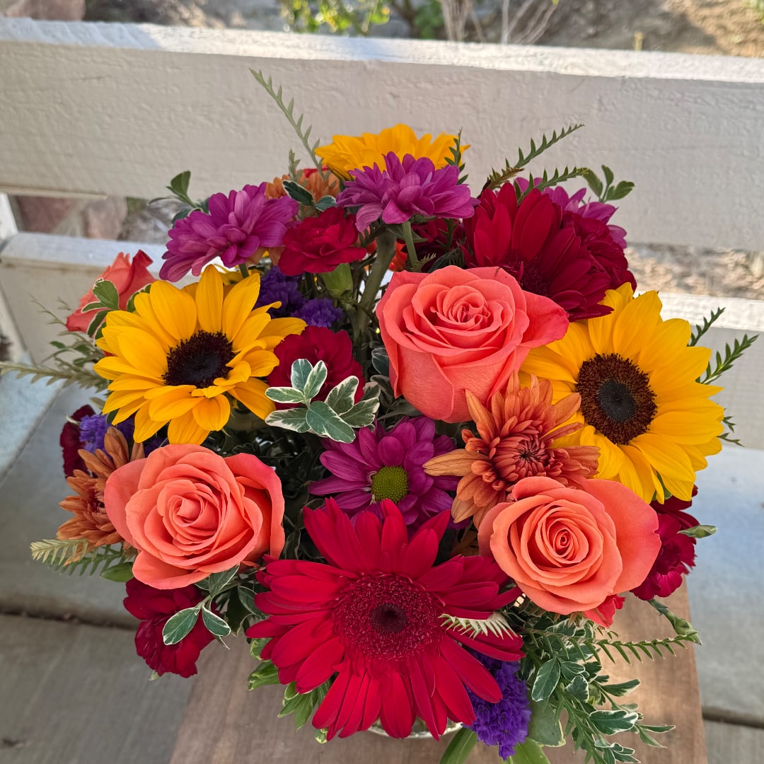 Mixed bouquet with roses, sunflowers, and gerbera daisies