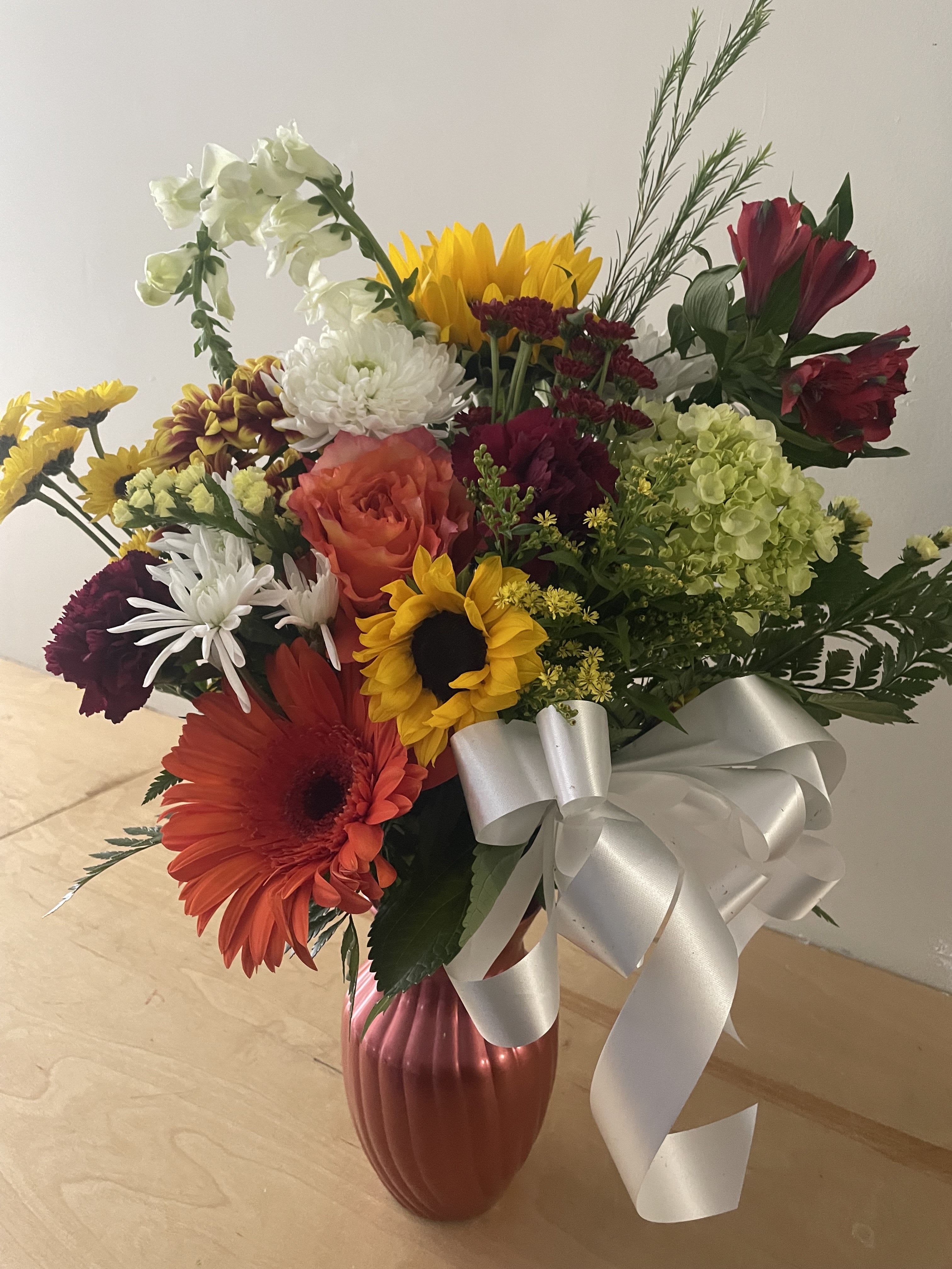 Autumn Day by Lotherington's - Beautiful fall mix brightens and soothes any space. Perfect for saying happy birthday, thinking of you or saying thank you. A crowd pleaser, this arrangement appeals to both the contemporary and the classic.   