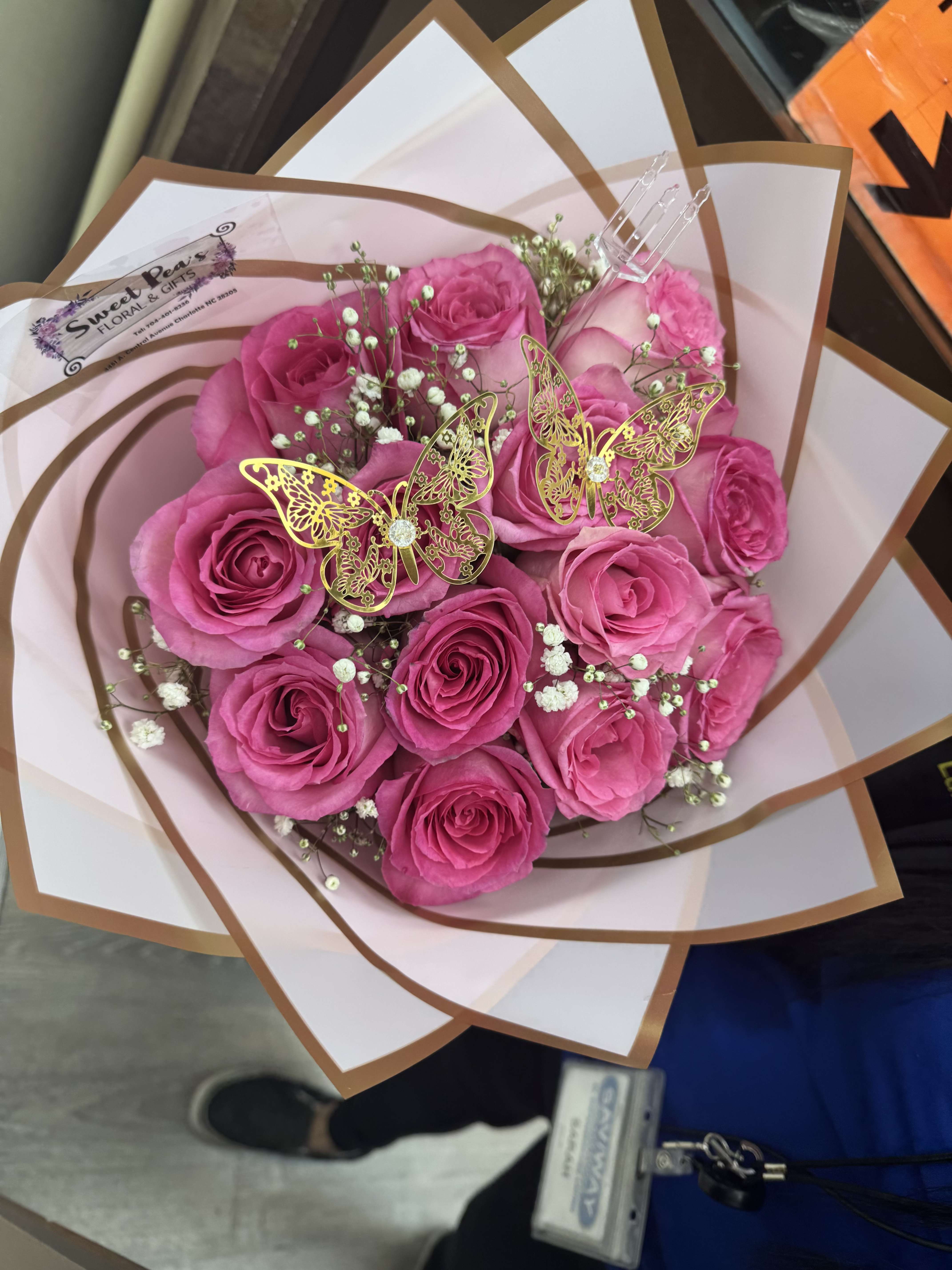 Pink rose bouquet with baby’s breath and butterfly picks