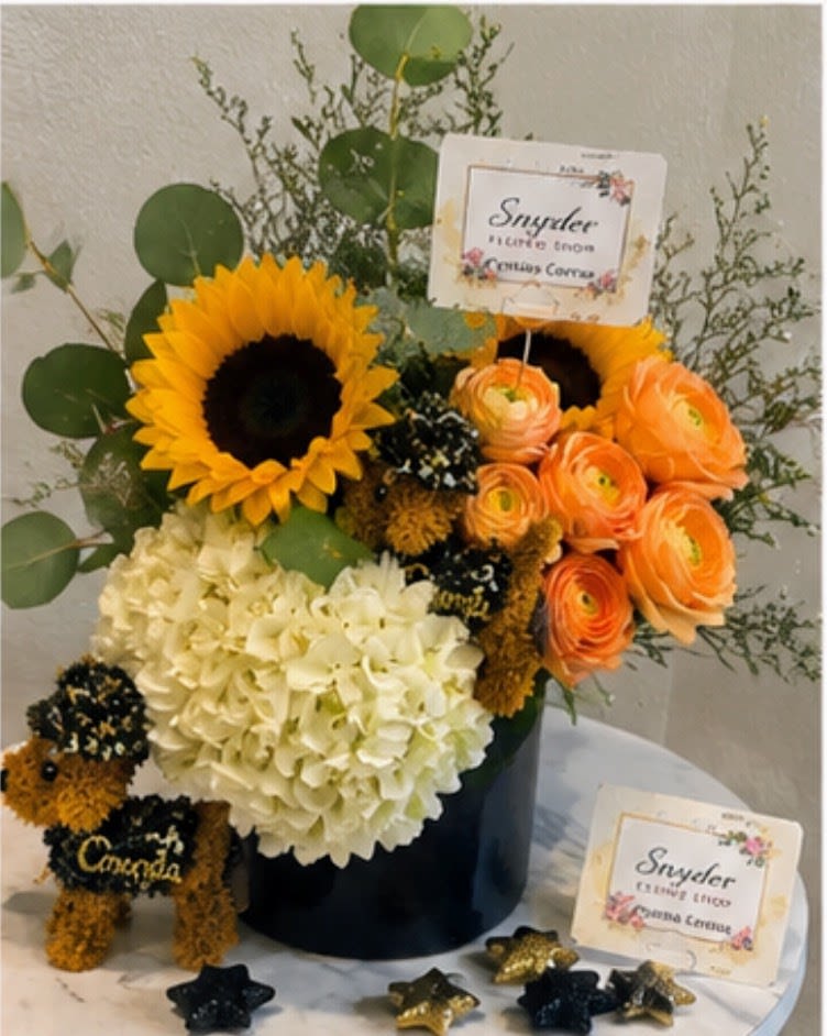 Golden Graduate Luxury Bouquet - Luxury graduation flower arrangement handcrafted with fresh sunflowers, hydrangeas, ranunculus and premium seasonal flowers by Snyder Flowers in San Antonio. Elegant graduation bouquet designed to celebrate special achievements with fresh high quality flowers, modern floral design and personalized details perfect for graduations, celebrations and unforgettable moments. Our San Antonio florist specializes in same day flower delivery, luxury floral arrangements, graduation flowers and custom bouquets made with care and attention to every detail. Local flower shop offering affordable luxury flowers, fresh floral designs and reliable same day delivery across San Antonio for every special occasion.