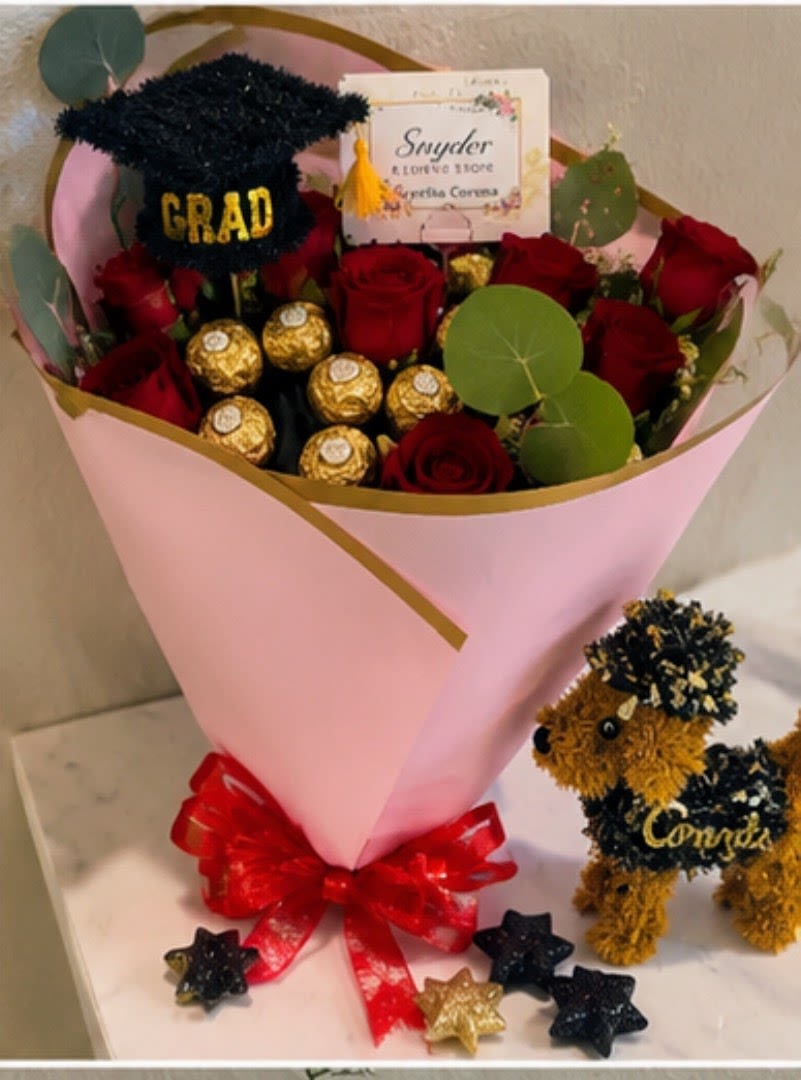 Graduation Luxe Rose Bouquet - Luxury graduation flower bouquet with premium red roses, Ferrero Rocher chocolates and elegant graduation decor handcrafted by Snyder Flowers in San Antonio. This beautiful graduation arrangement is perfect for graduates, celebrations, congratulations gifts and special moments. Our San Antonio florist creates fresh premium flower bouquets with same day flower delivery, luxury wrapping and affordable prices. Snyder Flowers specializes in elegant graduation flowers, custom rose bouquets, fresh floral arrangements and high quality flowers designed with care for every customer. Same day flower delivery available across San Antonio for graduations, birthdays, anniversaries and special occasions.