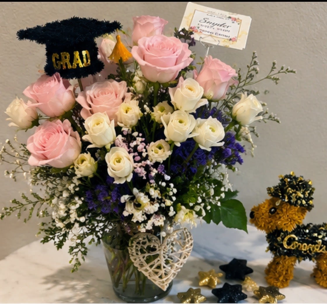 Blush Graduation Garden - Blush Graduation Garden. Luxury graduation flower arrangement with fresh pink roses, white spray roses and premium seasonal flowers handcrafted by Snyder Flowers in San Antonio. This elegant graduation bouquet is designed with soft romantic colors and fresh floral textures perfect for graduation celebrations, congratulations gifts, birthdays and special occasions. Our San Antonio florist specializes in luxury flower arrangements, fresh premium roses, custom floral designs and same day flower delivery with affordable pricing and exceptional quality. Snyder Flowers proudly creates handcrafted flower bouquets using fresh flowers selected with care to deliver elegant floral arrangements across San Antonio the same day.