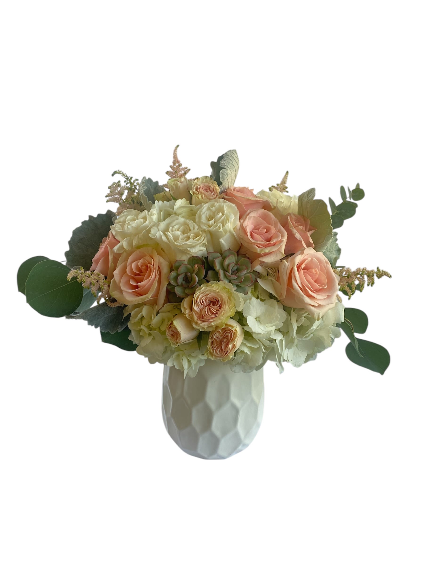 Peach and white rose bouquet in a white vase