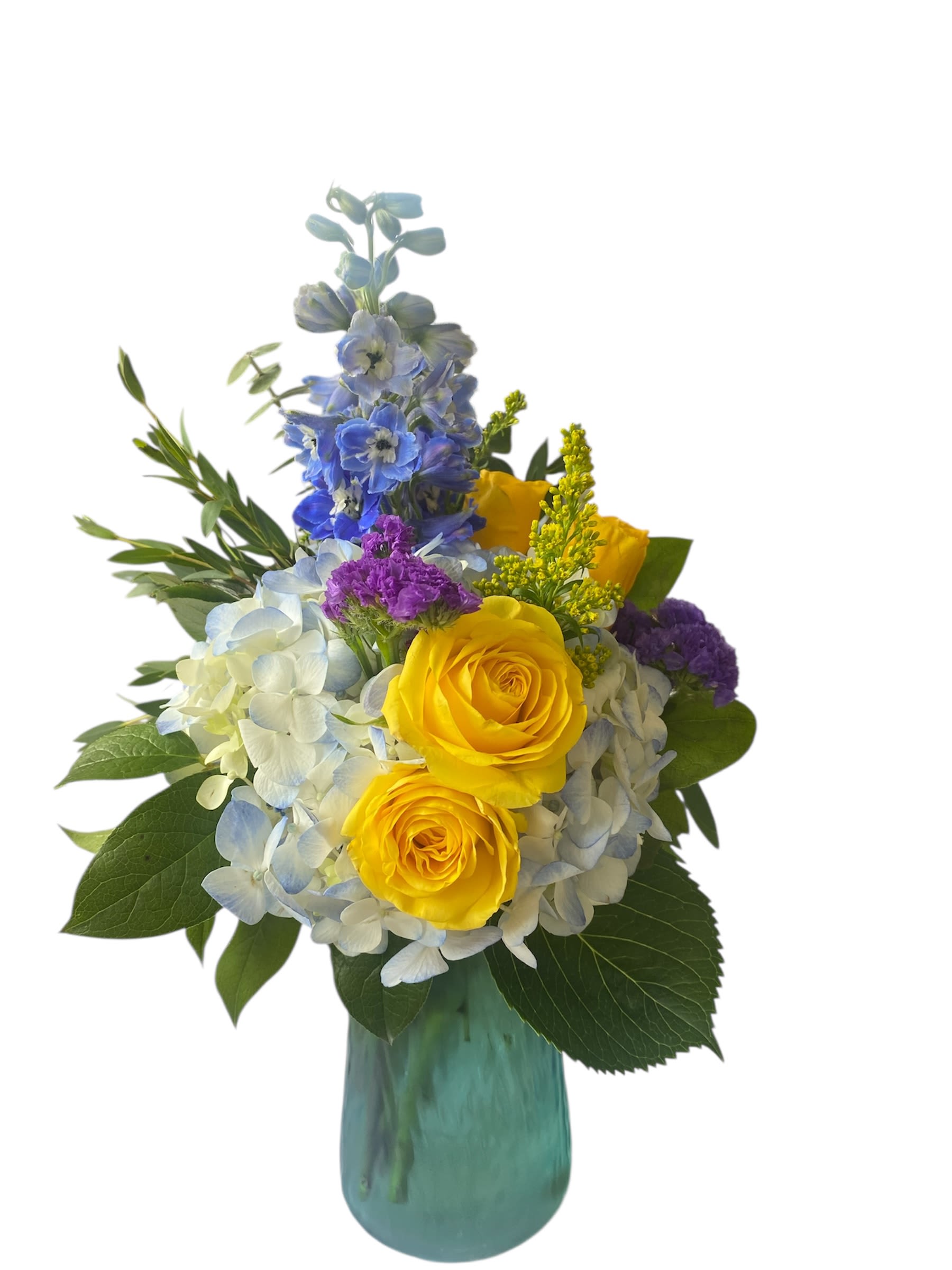 Yellow roses and blue hydrangeas in a teal glass vase
