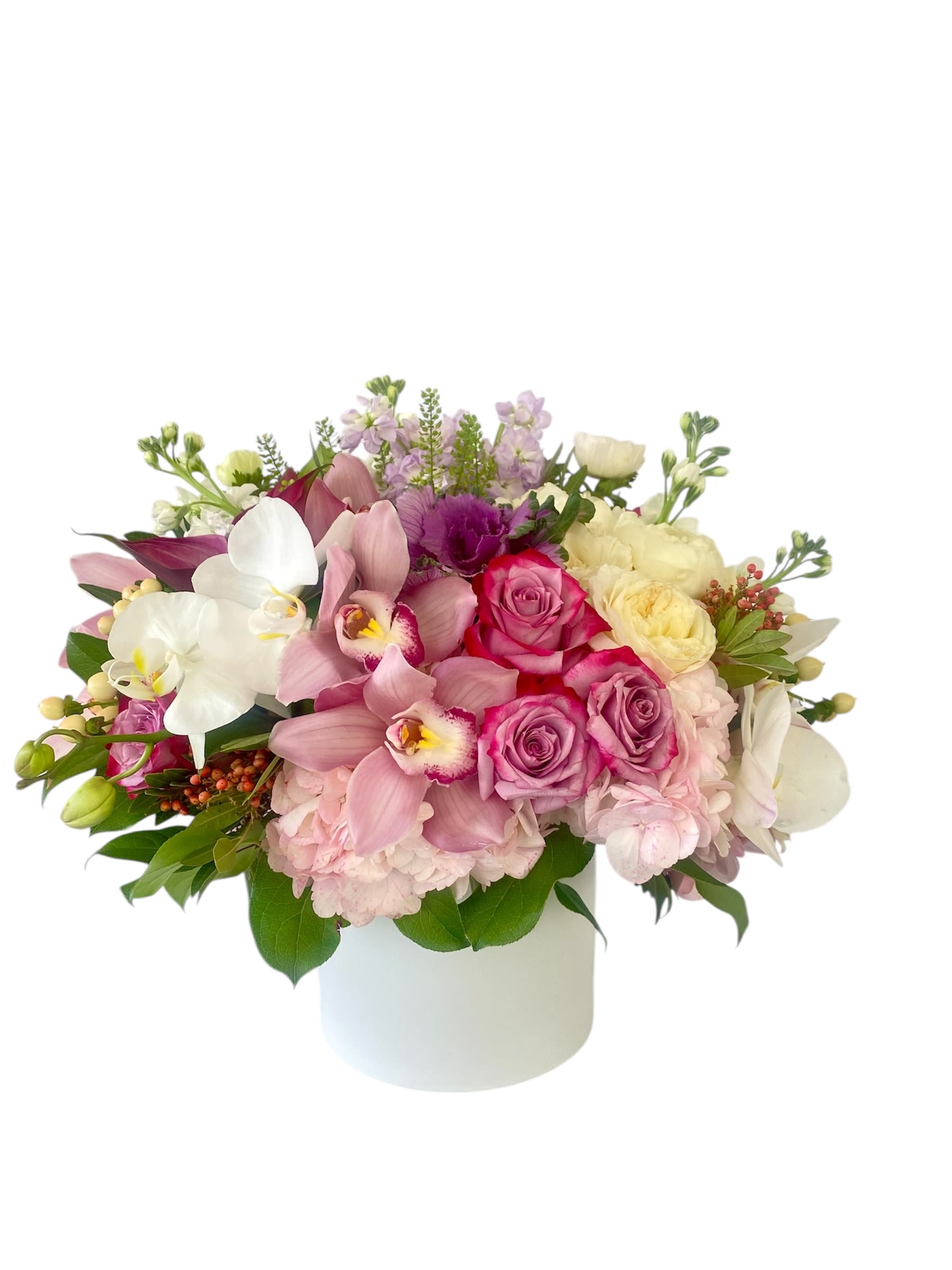 Pink and white mixed flower arrangement in a white vase