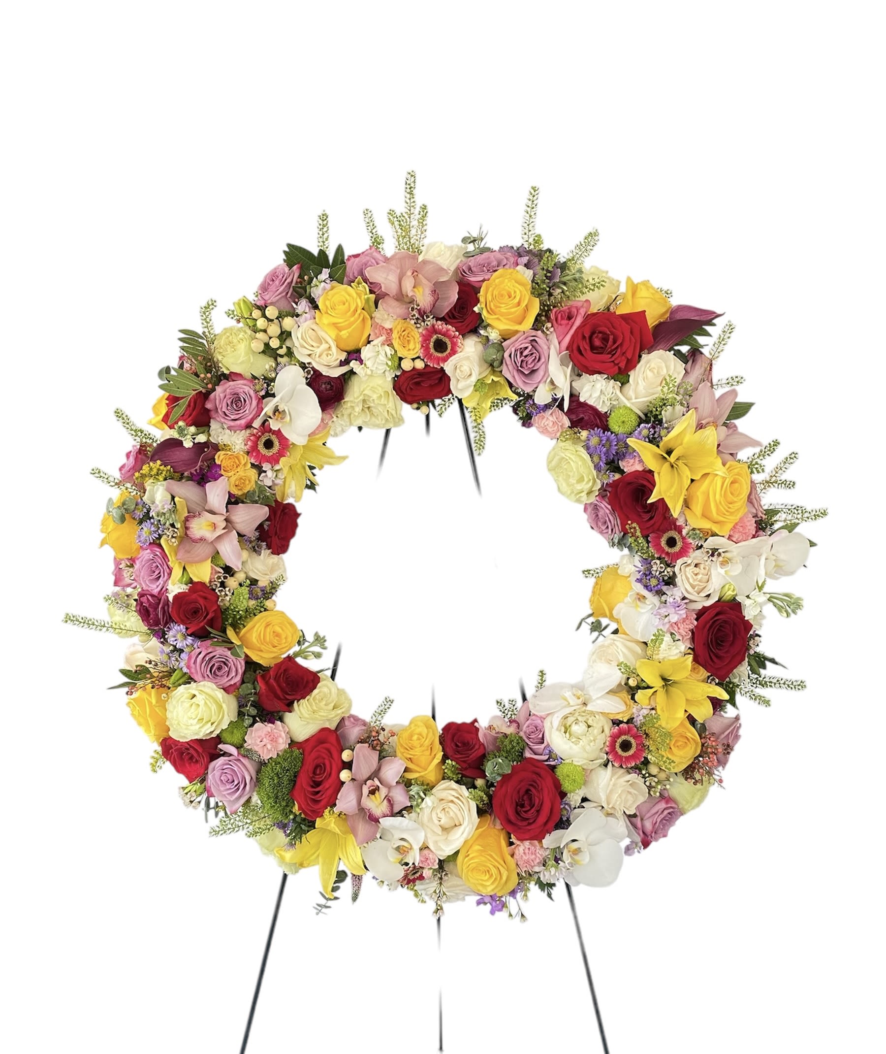 Circular floral wreath on a stand with roses, orchids, and lilies