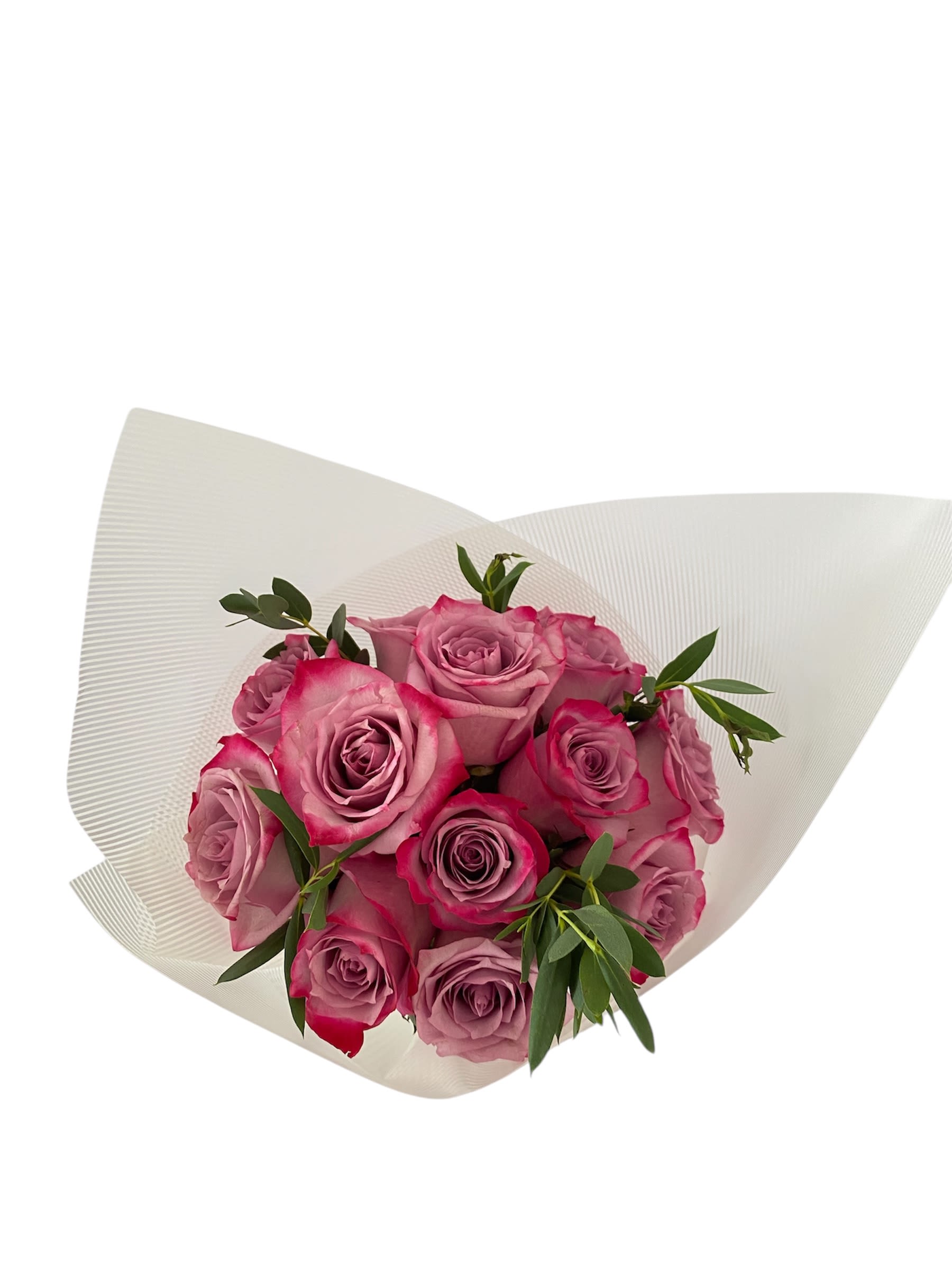 Bouquet of pink roses wrapped in white paper