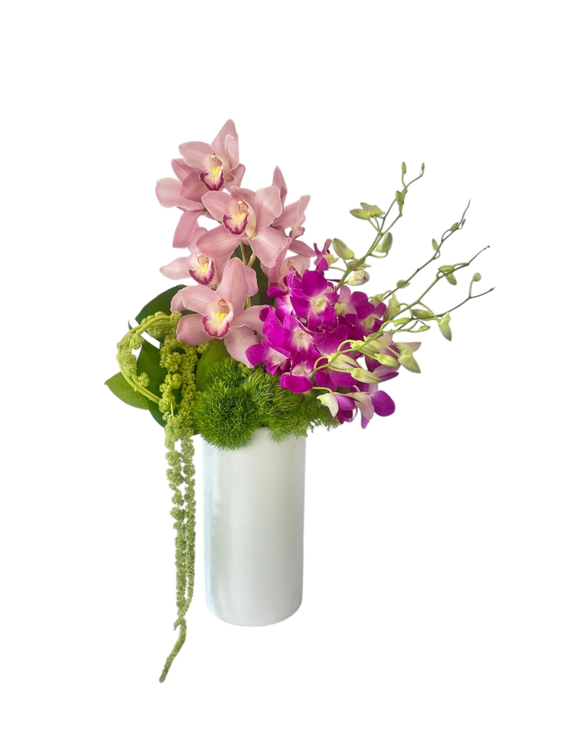 Pink and purple orchids arranged in a white vase