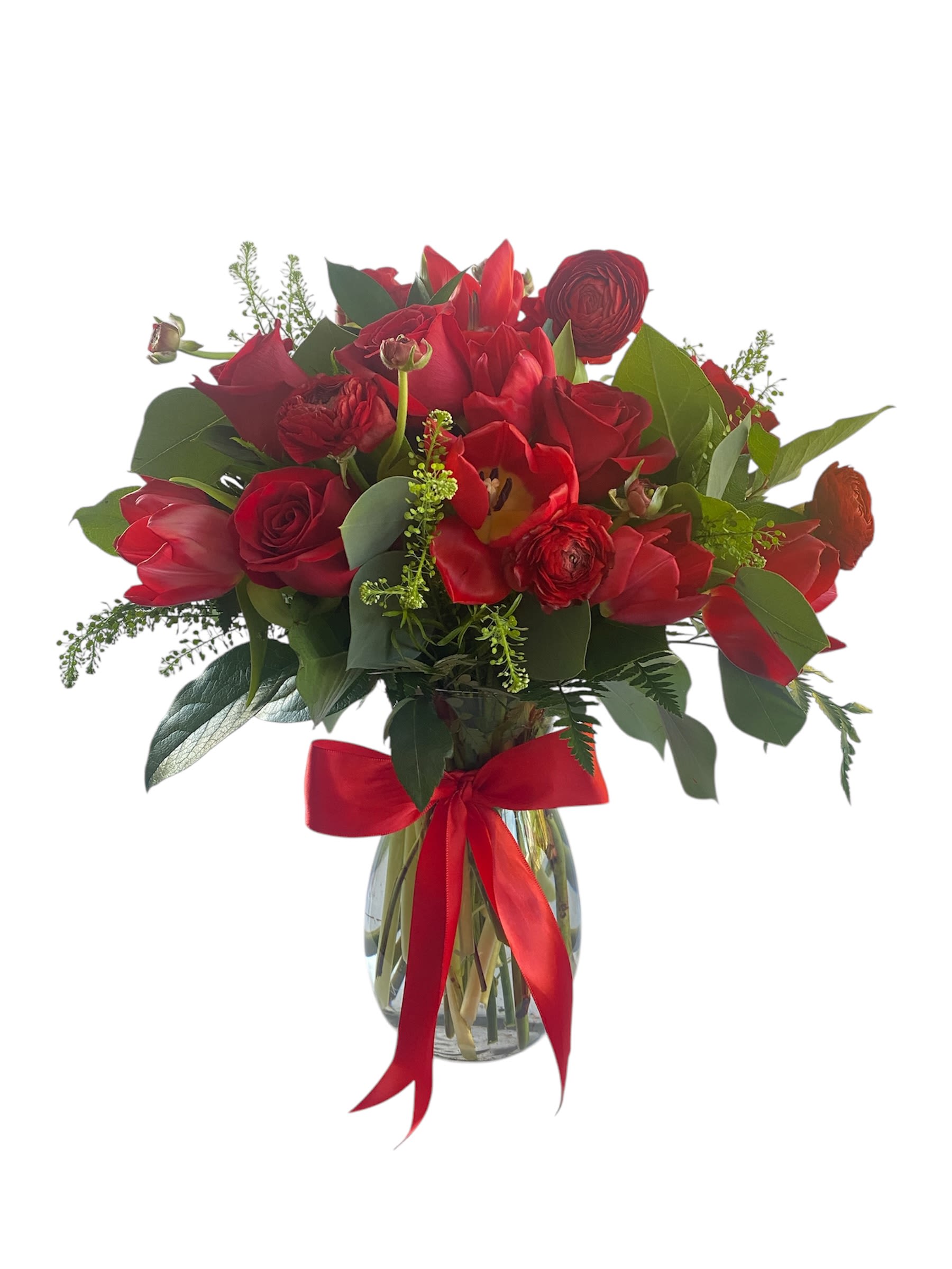 Red floral bouquet in a glass vase with a red ribbon