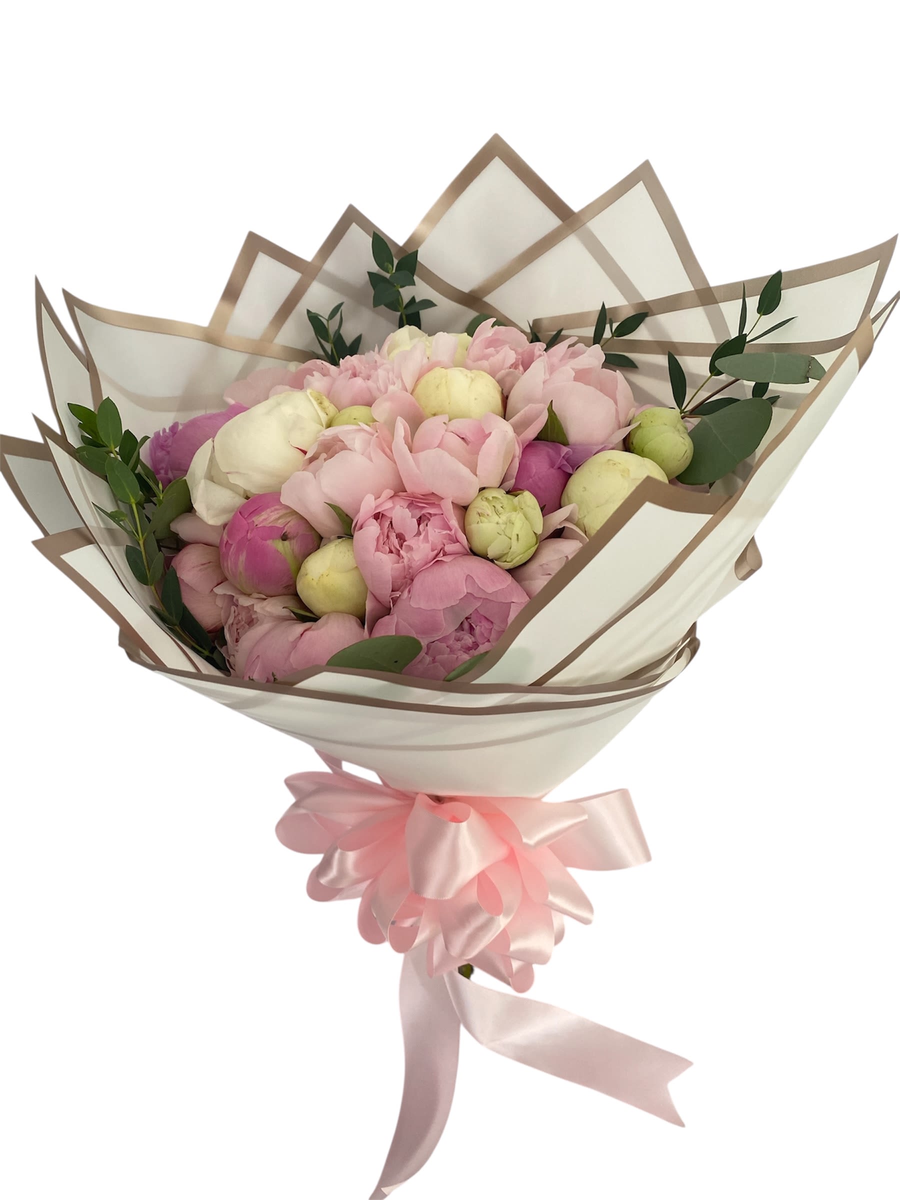 Bouquet of pink and cream peonies wrapped in translucent paper with a pink ribbon