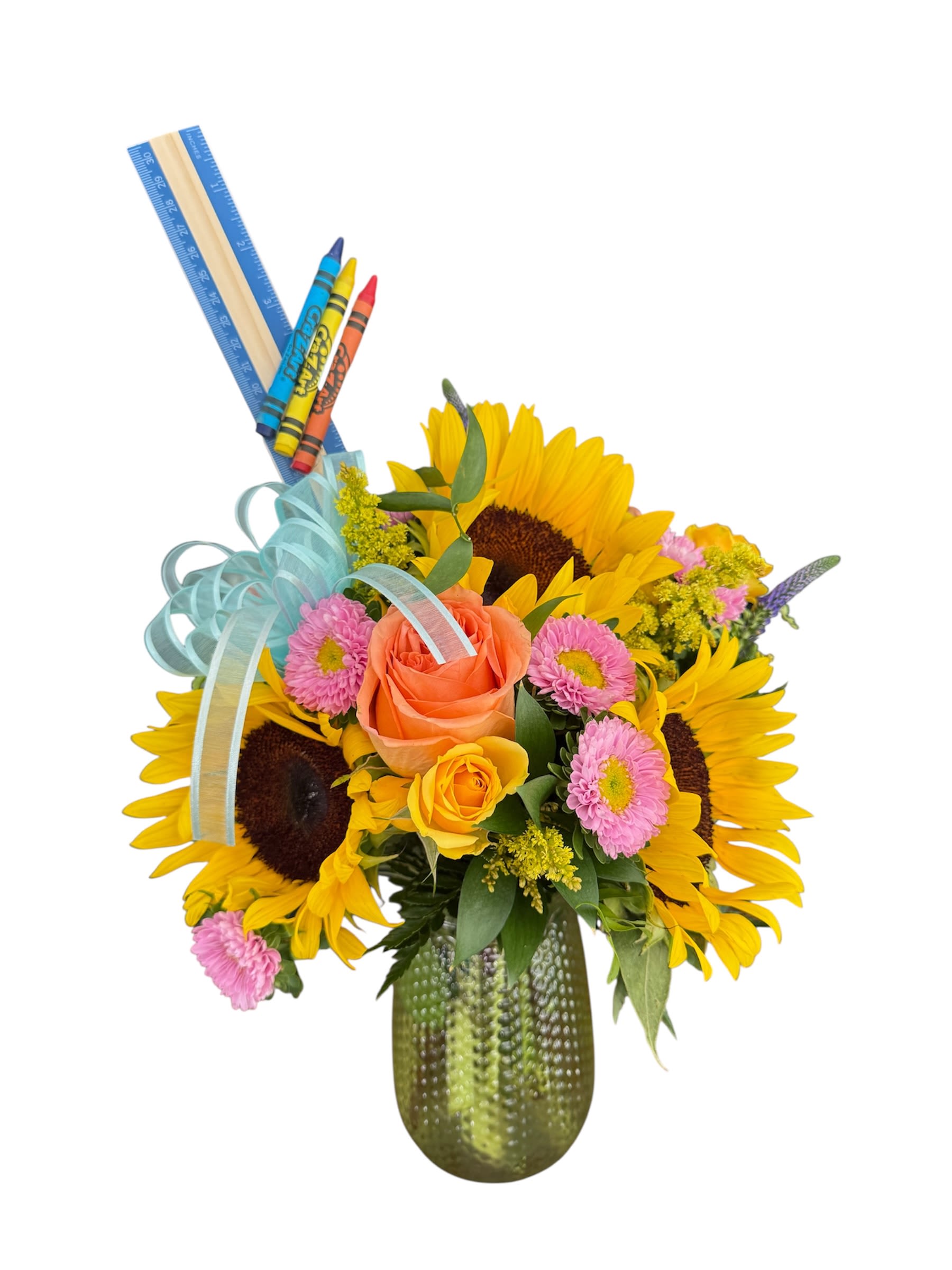 Sunflower and rose bouquet in a green vase with crayons and ruler