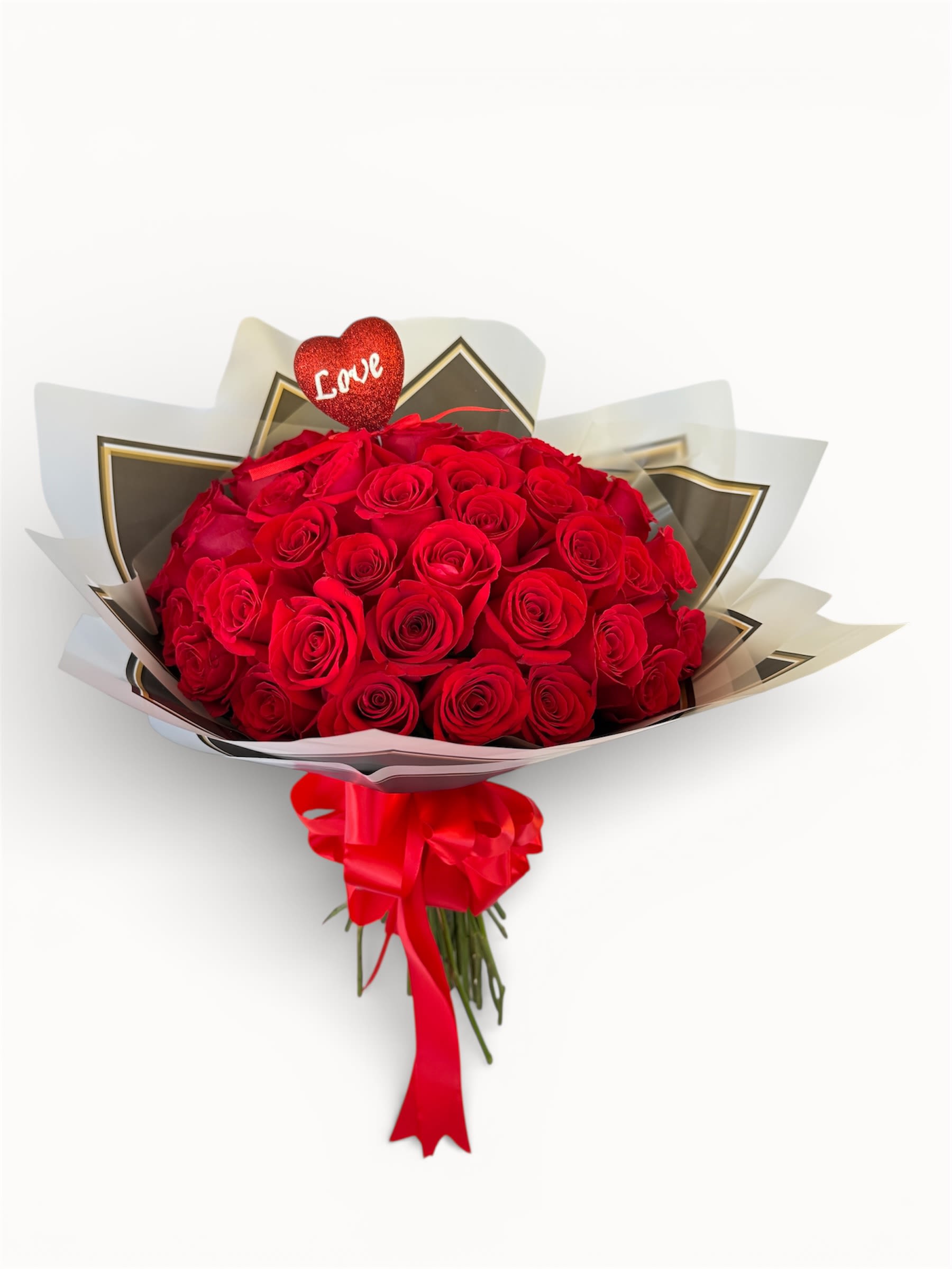 Bouquet of red roses with a heart topper and red ribbon