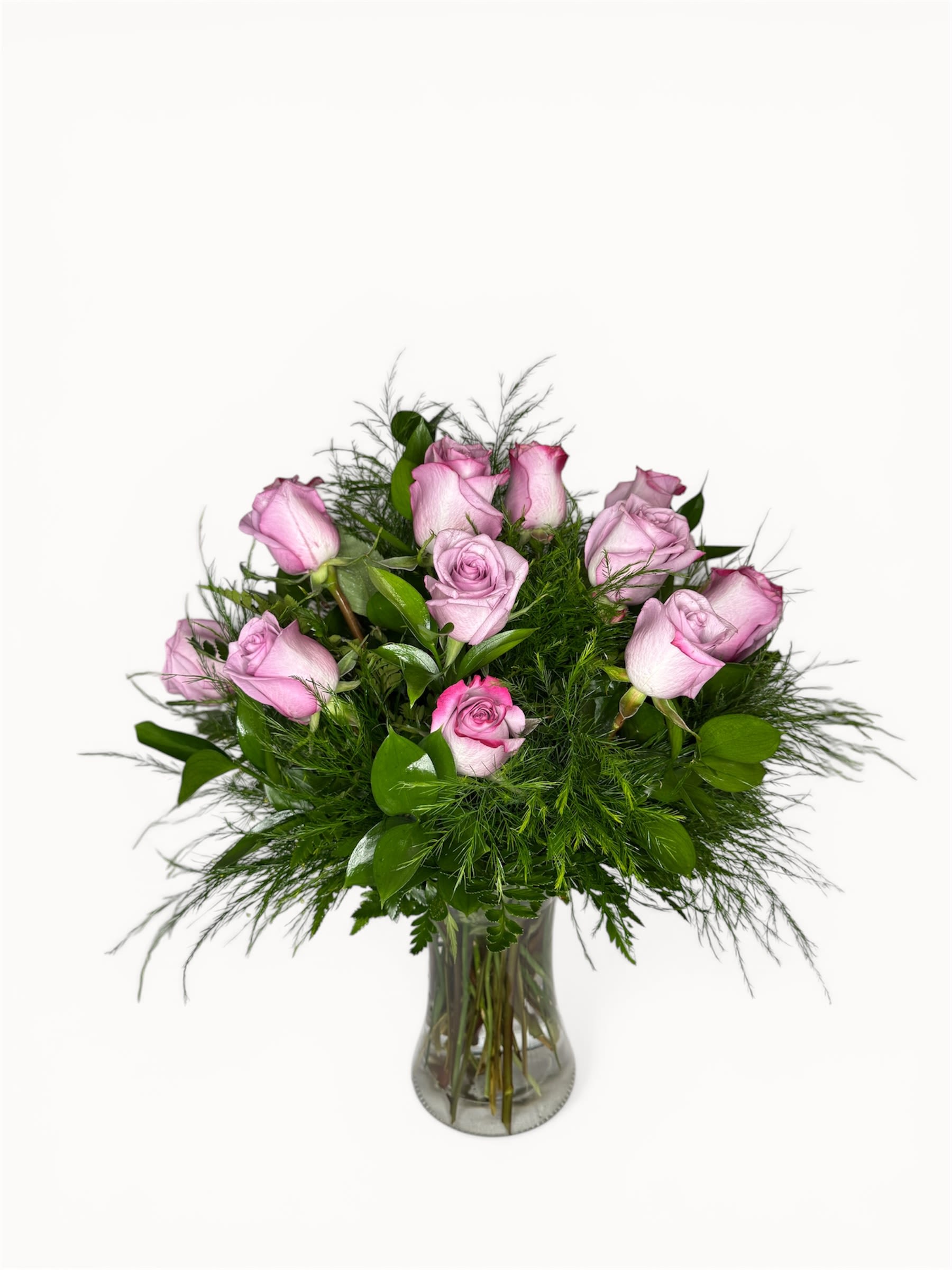 Amethyst Elegance - 12 lavender roses gracefully arranged with greens and filler accents in a glass modern vase.