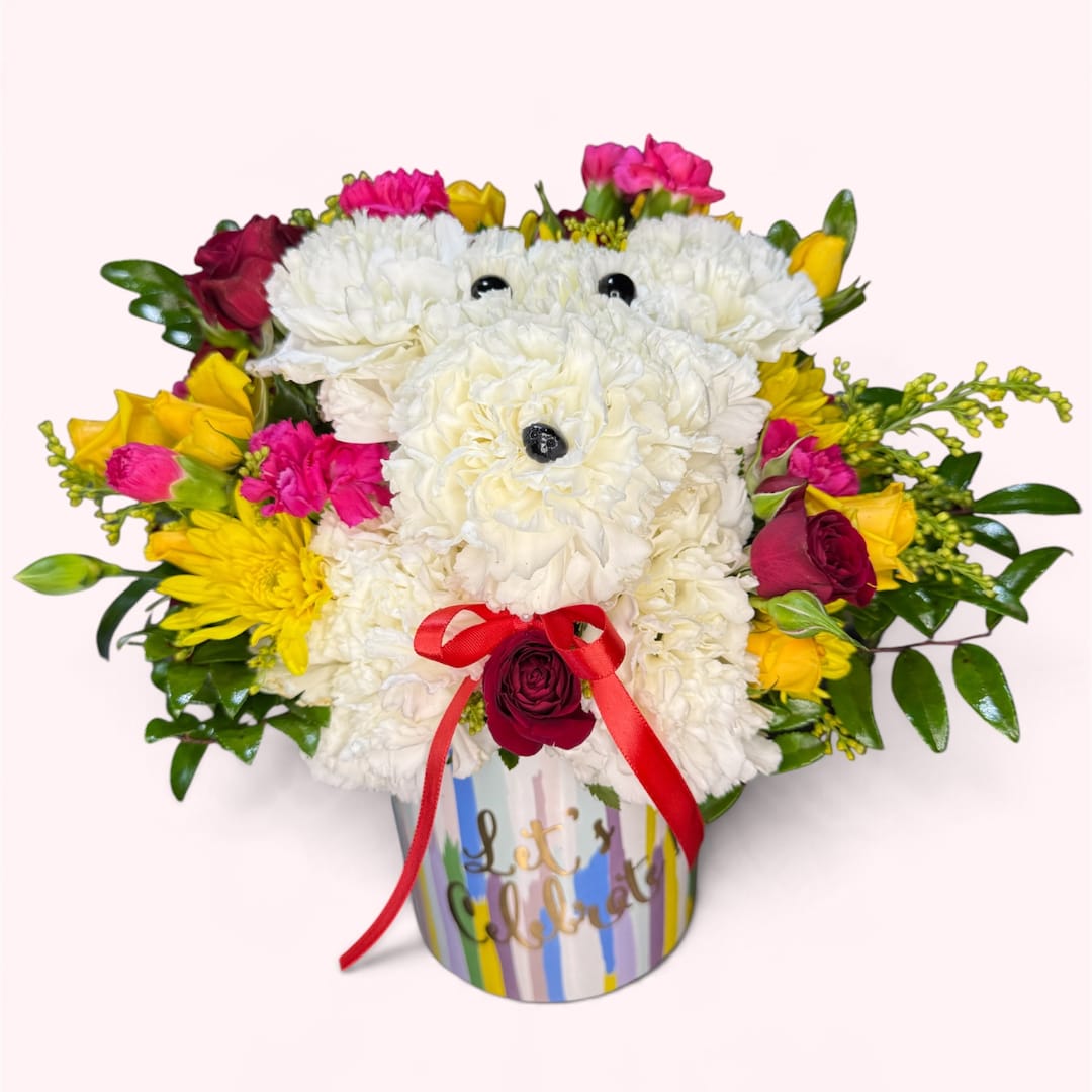 White teddy bear made of flowers in a striped container with a red bow