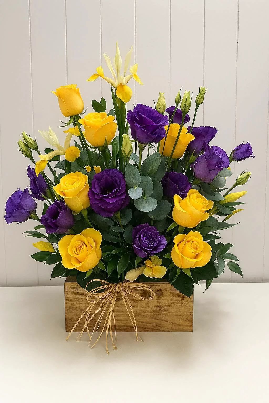 Royal sunshine  - Hand selected fowers in royal purple and golden yellow arranged with artistry to create a powerful and sophisticated floral display.