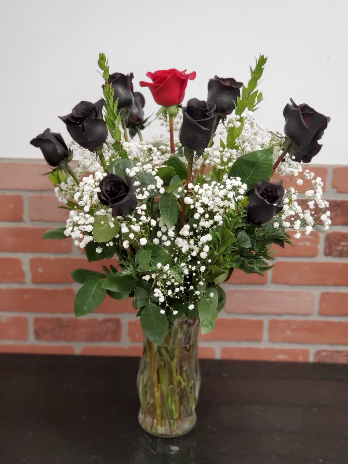 Black Rose's with 1 Red  - Black Rose's with 1 Red nice combination like the picture 12 Rose's  Medium 18 Rose's  Large 24 Rose's 