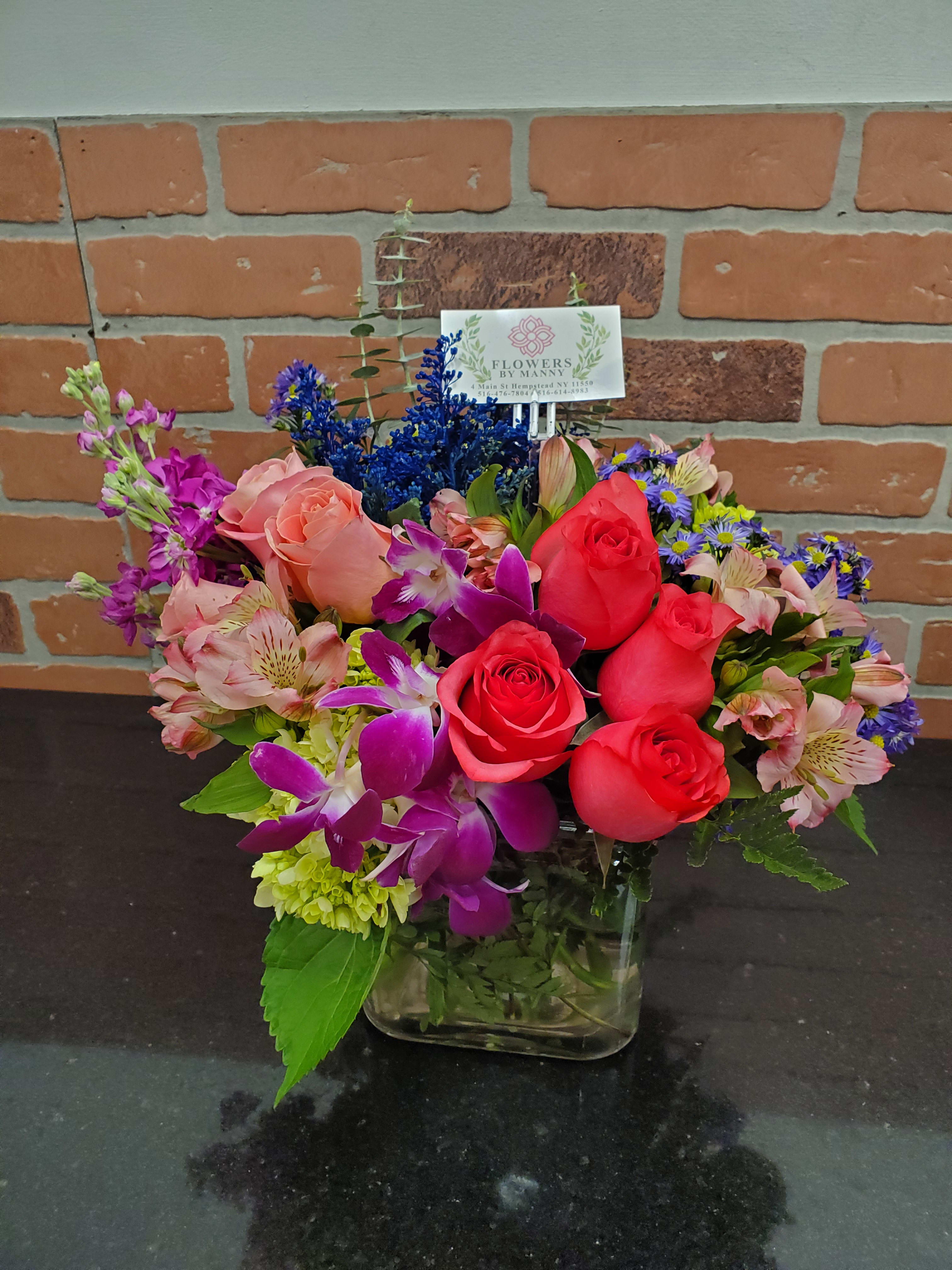 A colorful summer  - Mixed flowers for a garden looking arrangement.