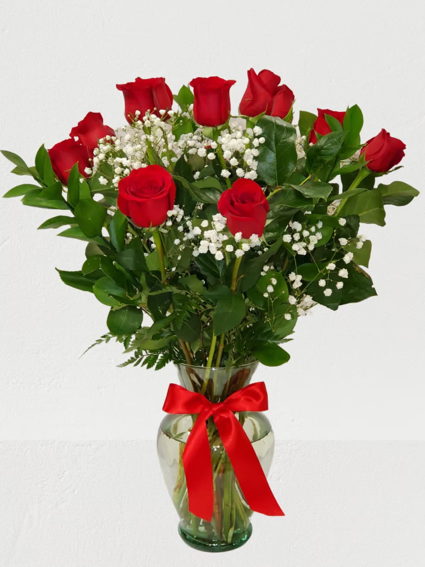Dozen Red Rose's in a vase with baby breath - Red Rose's in a vase always make someone happy they came in 3 sizes  Standard - 12 Roses  Deluxe - 18 Roses Premium - 24 Roses