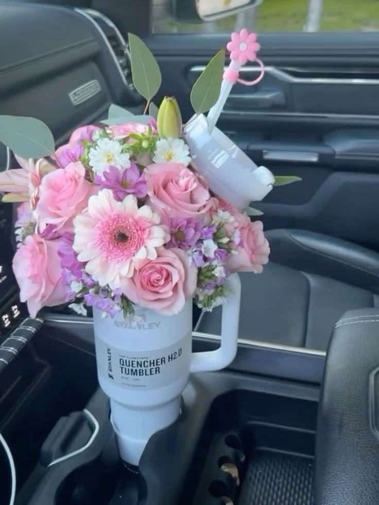 Delicate but Intense  - Soft petals meet bold emotions. This elegant floral design in a Stanley mug blends tenderness and intensity — the perfect balance for a love that’s both sweet and powerful.  Includes delivery — Let Yansa Flowers turn your feelings into beauty! ️ 