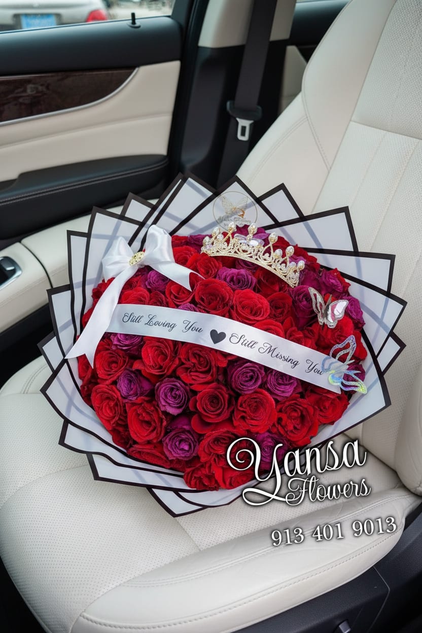 100 Royal Passion - A stunning blend of red and purple roses wrapped in crisp white paper — elegance, romance, and a touch of magic in every bloom. Yansa Flowers — delivering beauty and love to every doorstep. 