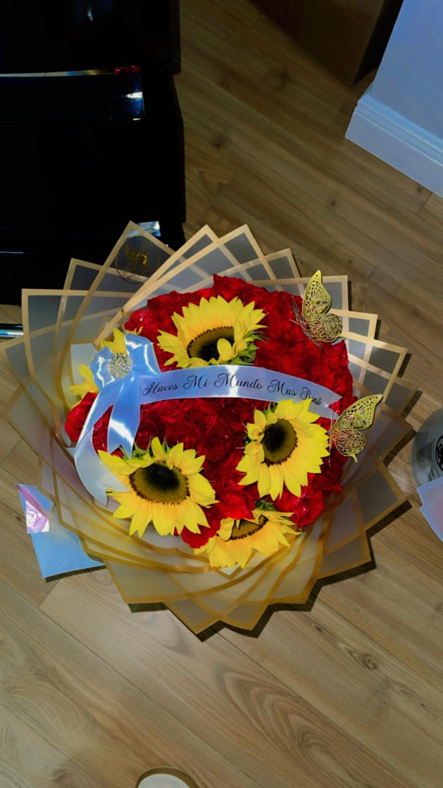 75 Radiant Passion - Our Radiant Passion arrangement combines deep red roses with vibrant sunflowers, symbolizing love, joy, and warmth in perfect harmony. Each bloom is hand-selected and arranged with meticulous care to ensure that every detail reflects quality and elegance.