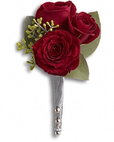 Three red rose boutonniere with silver ribbon wrap