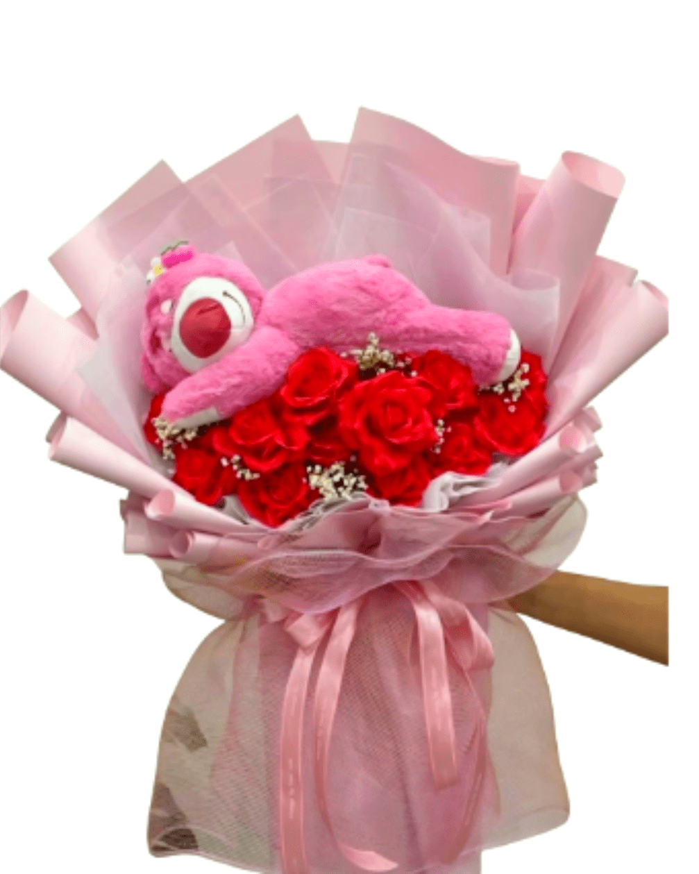 The Pink Bear Hug Bouquet - The Pink Bear Hug Bouquet is the ultimate expression of sweetness. This oversized, handcrafted arrangement features a lush bed of premium pink roses and delicate airy fillers, cradling a large, ultra-soft plush bear.