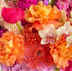Bright mixed bouquet with orange, pink, and purple flowers