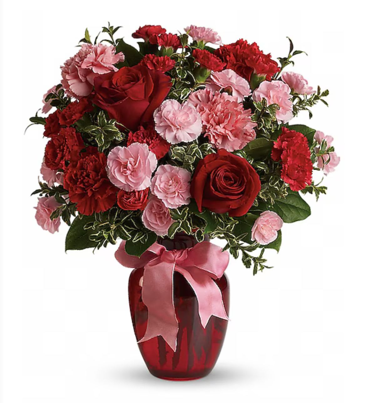 Red roses and pink carnations in a red vase with a pink ribbon