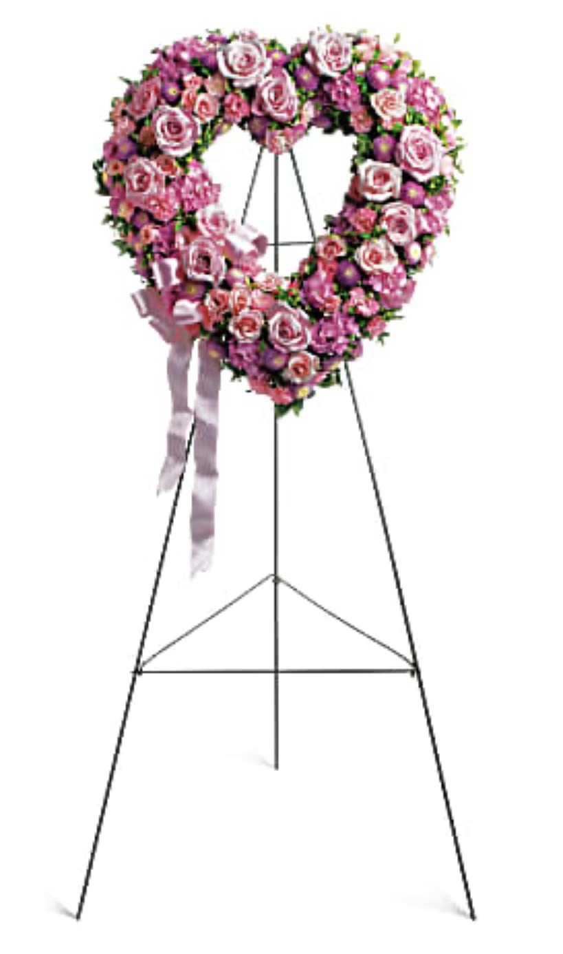 Pink and white floral heart wreath on a standing easel with ribbon