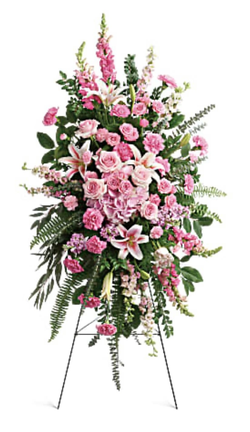 Tall pink floral standing spray on an easel