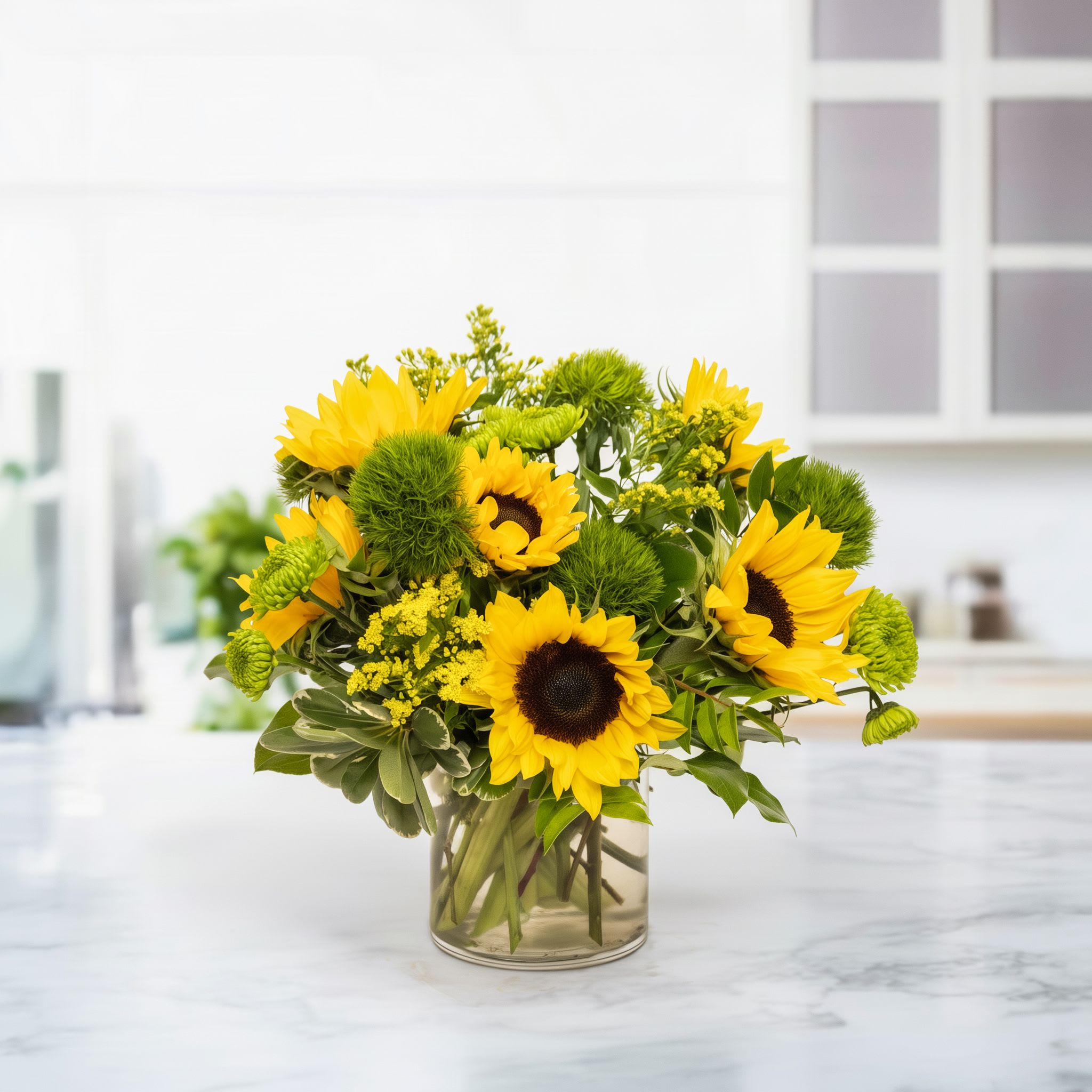 Sunflower &amp; Green Bliss - Sunflower &amp; Green Bliss is a vibrant and cheerful floral arrangement featuring bright sunflowers paired with lush green dianthus and fresh seasonal greenery. This stunning bouquet radiates warmth, happiness, and natural beauty, making it perfect for birthdays, thank-you gifts, housewarmings, or simply to brighten someone’s day.