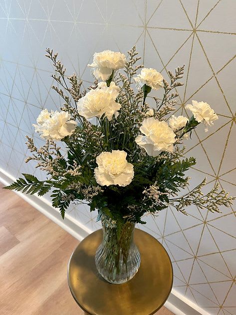 Carnations - Whether it's a thoughtful surprise or a treat for yourself, carnations add joy to any space!   Please call to inquire about other colored carnations and/or larger quantities!