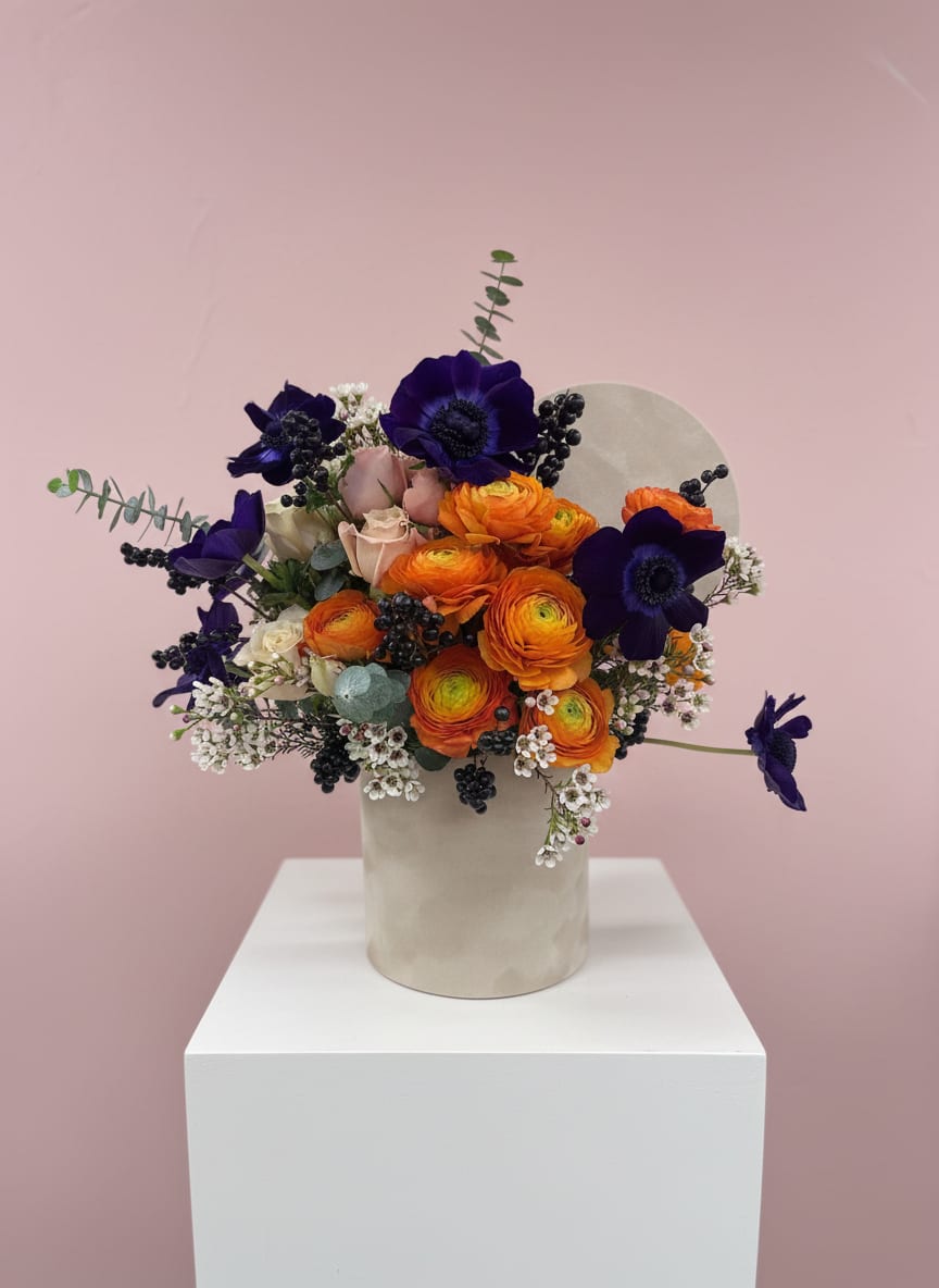 Burnt &amp; Beautiful - Burnt &amp; Beautiful Raw, warm, and impossibly striking. Deep oranges and rust tones that feel both earthy and elevated. Flower varieties and vessels may vary based on availability to ensure the highest quality.