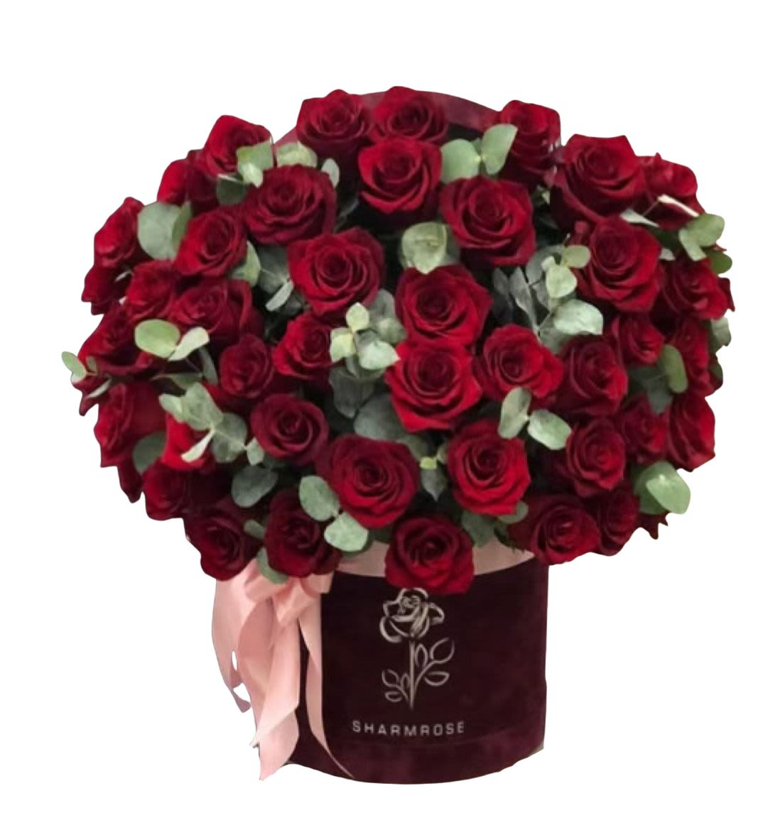 Bouquet of red roses in a burgundy hatbox with a pink ribbon