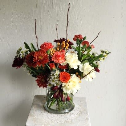 Fallen In Love - A fresh mix of stems chosen for their color and character—ready to be shaped into a personal masterpiece.  Important Note: We are a custom design studio florist in a small town. Every bouquet we create is a one-of-a-kind creation, tailored to the season, availability of flowers, color choice, artistic interpretation, and the current materials available. The photos do not represent the exact flowers that will be delivered. They are intended to provide you with an idea of what we do, how we do it, and the variance that can be expected. 