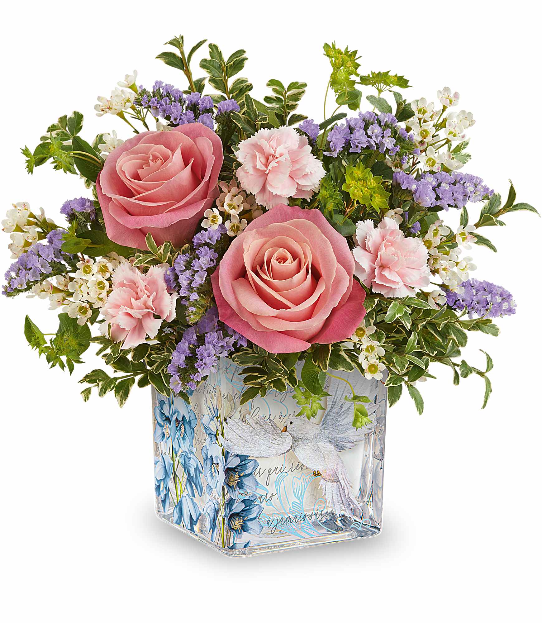 Whispers of Grace Bouquet - Softly serene, Whispers of Grace Bouquet blends pink roses and delicate pastel blooms in a glass cube adorned with peaceful doves and blossoms-a heartfelt reminder of love, hope, and gentle beauty.