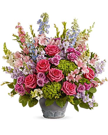 Teleflora's Keep Blooming Bouquet - Make a special moment even more memorable with this amazing array of roses and hydrangea in a timeless European-style pot. This arrangement features green hydrangea, hot pink roses, lavender spray roses, light pink alstroemeria, light blue hybrid delphinium, pink larkspur, white snapdragons, lavender stock, myrtle and lemon leaf. Delivered in a Parisian Garden Pot.