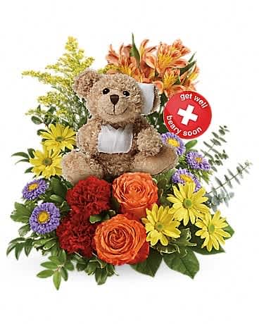 Teddy bear surrounded by colorful flowers with a get well soon sign