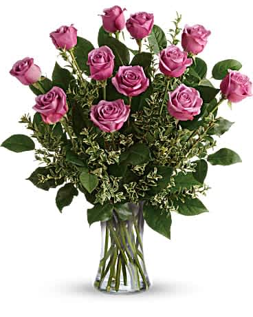 Hey Gorgeous Bouquet - A gorgeous greeting for any occasion, this lovely lavender bouquet features one dozen radiant roses with lush greens in a classic glass vase. This gorgeous bouquet includes 12 lavender roses, oregonia, and lemon leaf. Delivered in a glass gathering vase.