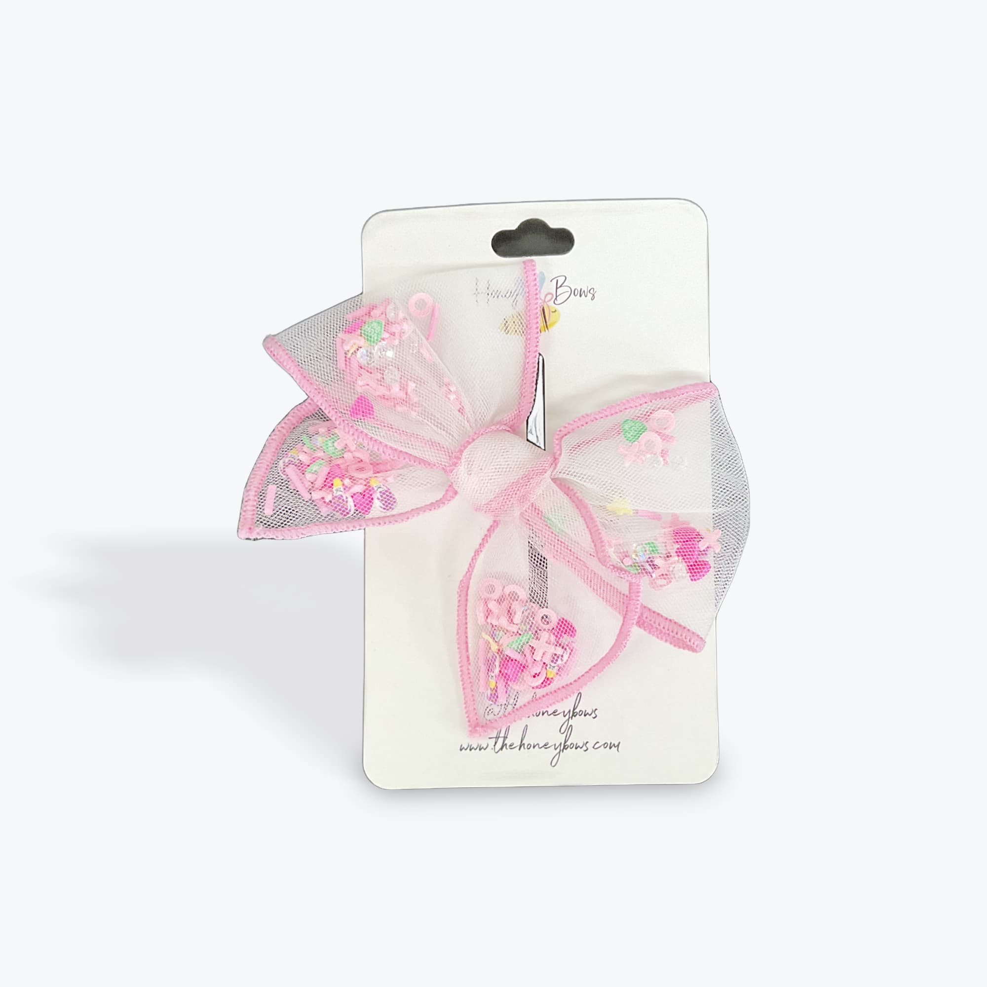Pink mesh hair bow on a retail card