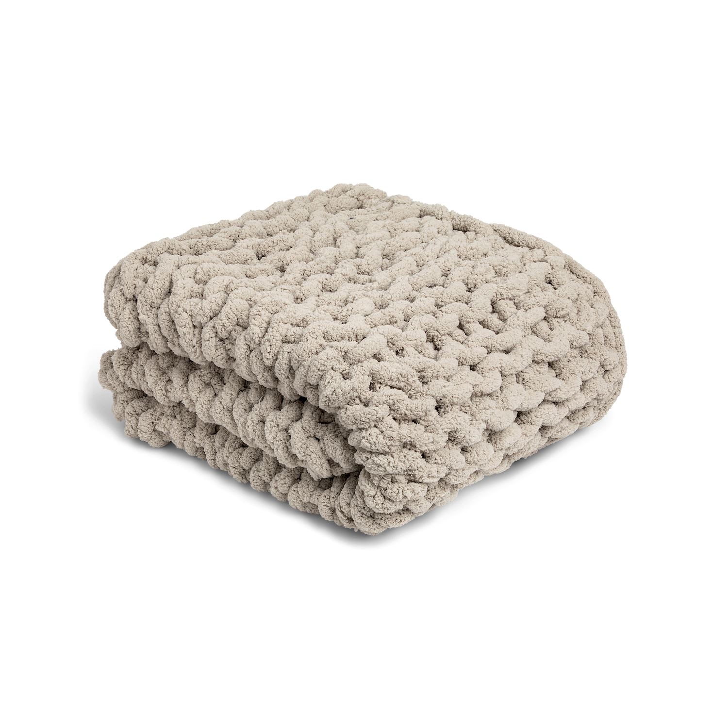 Folded beige chunky knit blanket on a white background