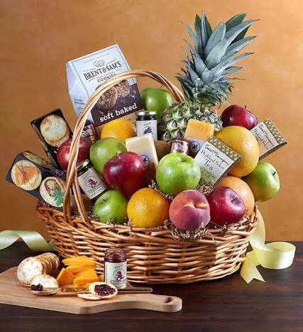 Large gourmet fruit and snack basket with apples, citrus, pineapple, cheese, and cookies