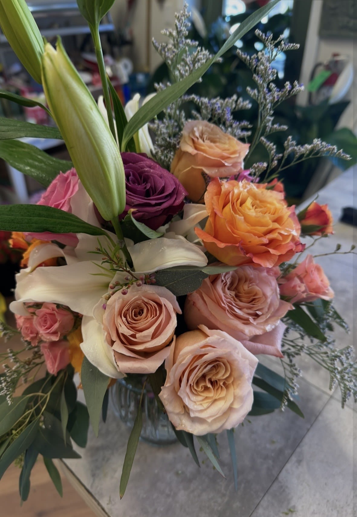 BRIDGERTON BOUQUET - OLD FASHIONED FRILLY ROMANTIC BOUQUET OF FRILLY GARDEN ROSES, SPRAY ROSES, LILLIES AND EUC AND WAX OR LIMO.  REMIND HER OF YOUR PAST TIME LOVE!