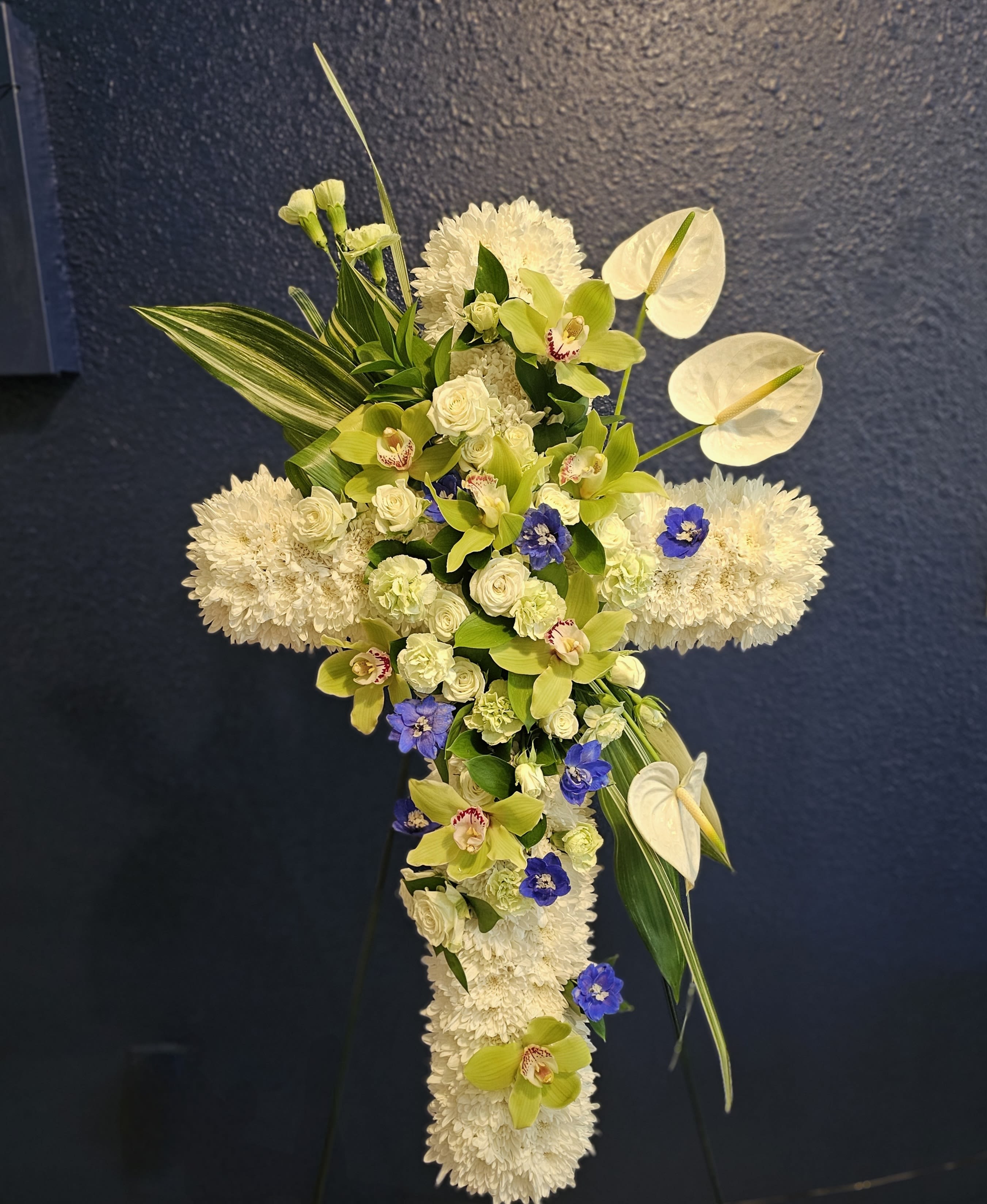 Green Goddess - Sympathy easel featuring gorgeous green orchids and white anthuriums