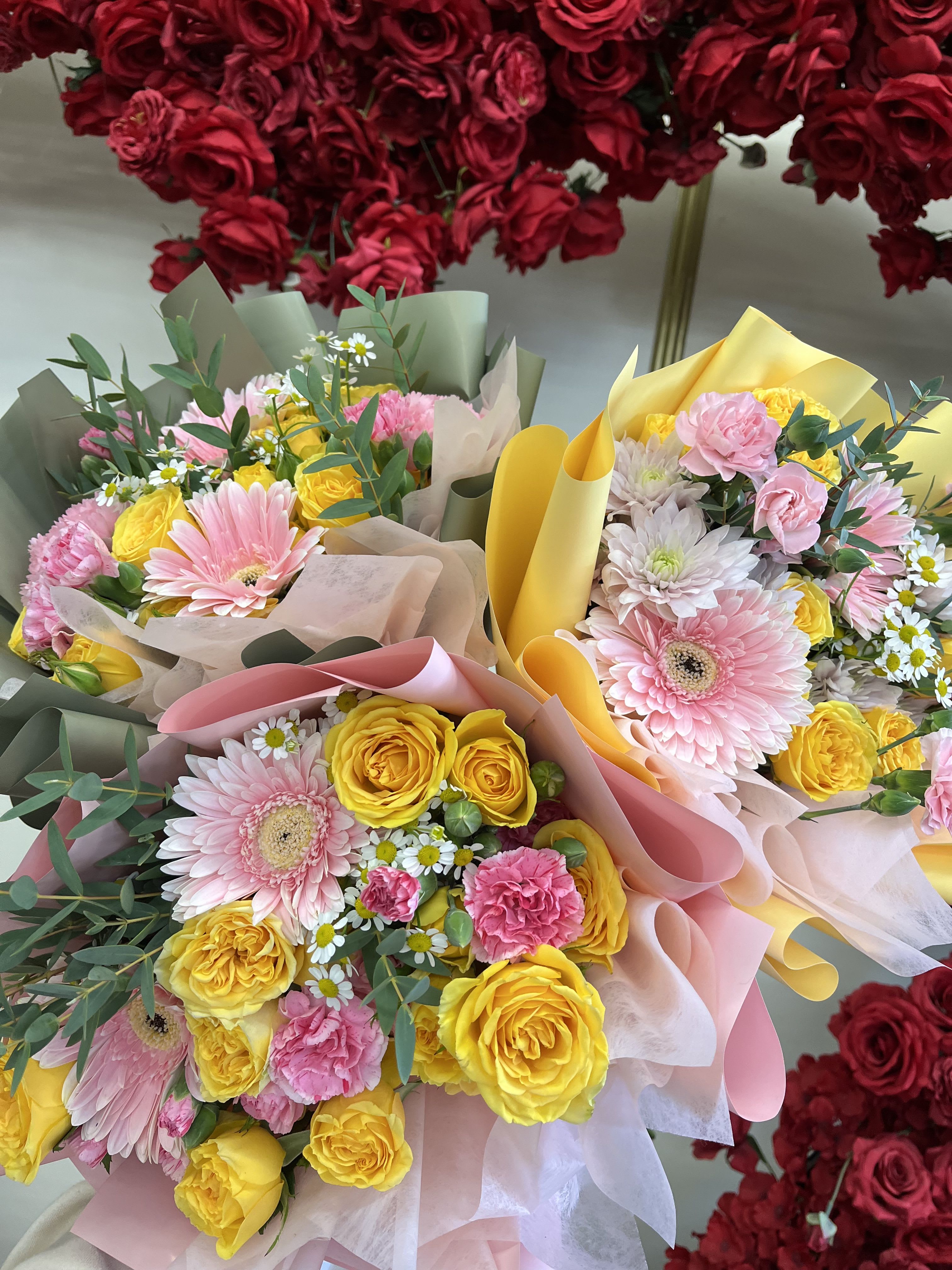 Florist Choice-Spring Pinks &amp; Yellow Wrapped Bqt - A fresh, spring-inspired hand-wrapped bouquet featuring a soft blend of yellow and pink blooms. Designed with the season’s best flowers, each bouquet is florist’s choice, allowing us to create a balanced, garden-style arrangement with natural movement and texture. Wrapped in our signature style, it’s perfect for celebrating, gifting, or adding a bright touch to any day. Flower varieties may vary, while the color palette stays true to cheerful yellows and soft pinks.