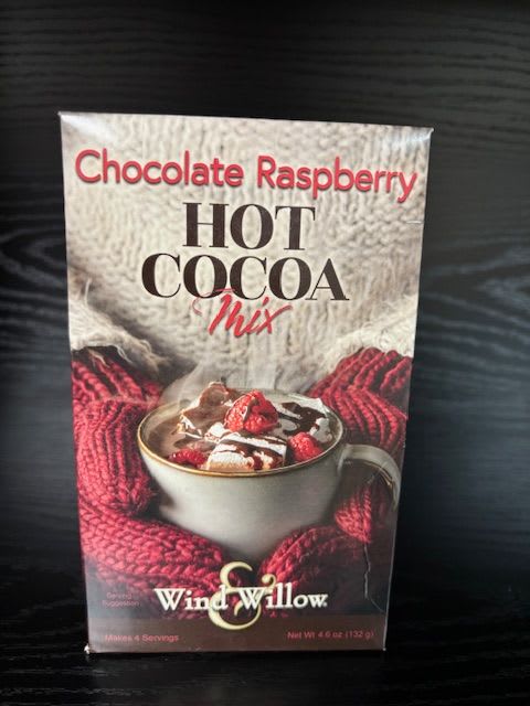 Chocolate raspberry hot cocoa mix box on a dark surface