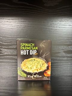 Box of spinach parmesan hot dip mix on a dark wood surface