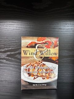 Box of Wind &amp; Willow turtle cheesecake mix on a dark table